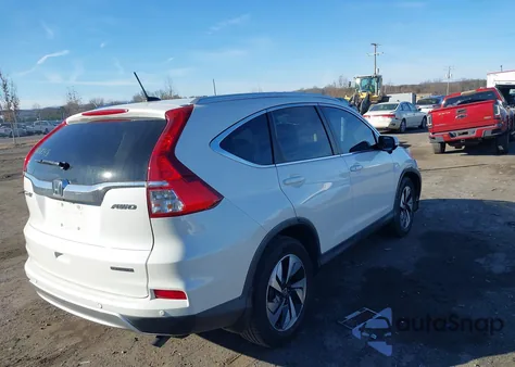 2016 Honda Cr-V Touring z USA, uszkodzony, nr VIN 5J6RM4H91GL034943